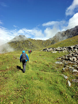 Grassy Himalayan valley and rocky peaks on the Hiramani Glacier trekking route