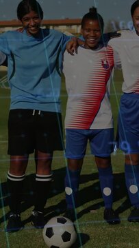 Vertical video: Cam panning up 3 players linking arms posing portrait grid showing over soccer ball