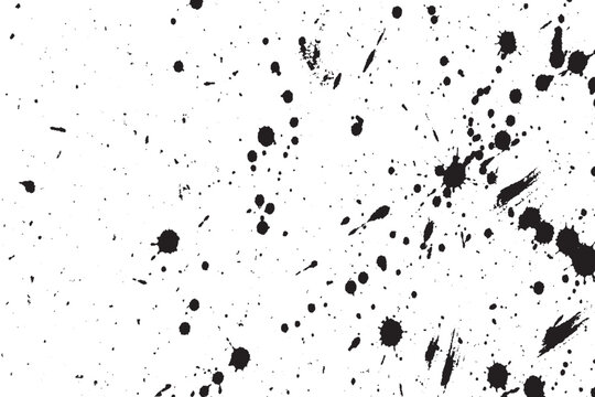 Abstract black ink splatters and spots texture on a white background