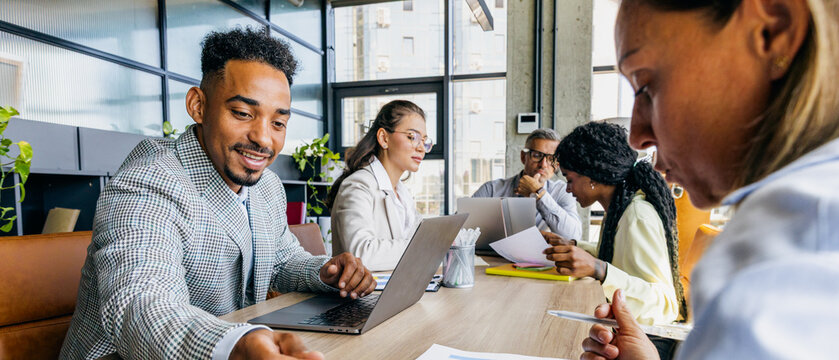 Team partner providing handson instruction in cheerful office setting