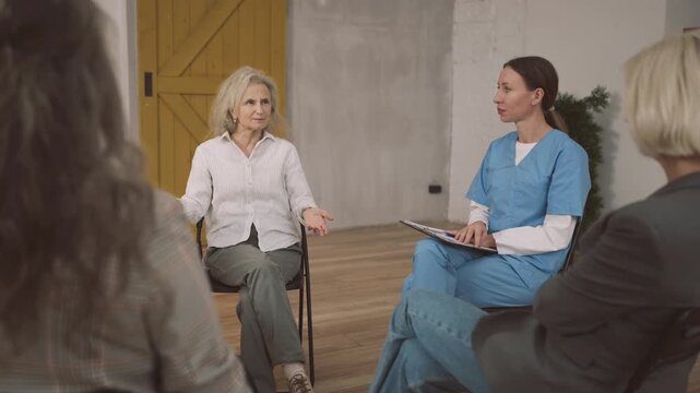 Group of aged ladies discussing aging process with endocrinologist in clinic. Gynecologist consulting senior women, anti-age and save healthy in menopause, consultation with therapist, mental health