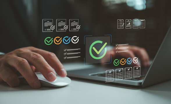 Businessman using laptop and mouse with digital checklist interface, approval checkmarks, document verification, task completion, compliance workflow, quality control, productivity management.