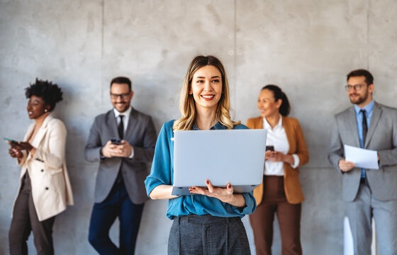 Professional in office environment, highlighting teamwork, collaboration, leadership, and innovation