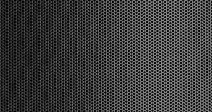 Black perforated surface texture.  Dark perforated surface with a repeating hole pattern, creating a textured and industrial look.