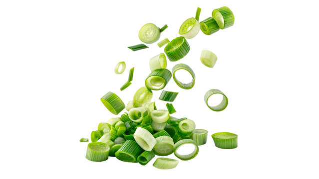 Fresh green onion pieces falling in the air isolated on transparent background