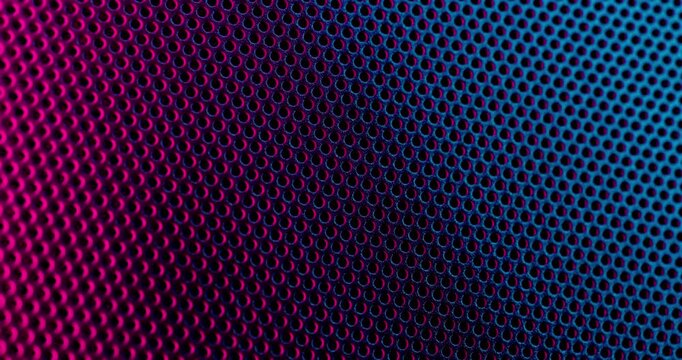 Color Perforated surface texture.  Close-up view of a color perforated surface with a repeating hole pattern, creating a textured and industrial look.