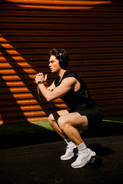 Athlete doing a deep squat outdoors