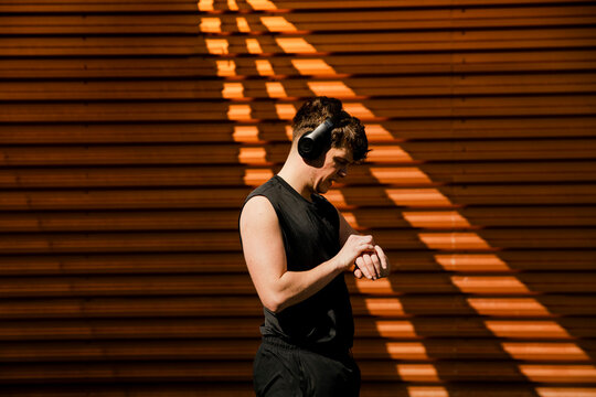 Athlete checking smartwatch during outdoor fitness training