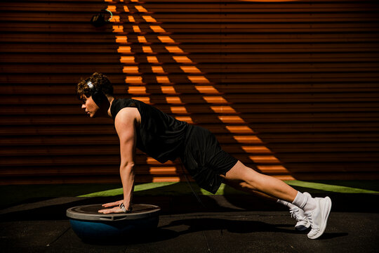 Athlete doing outdoor plank exercise for strength and fitness