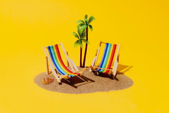 Miniature sandy island with rainbow beach lounger on yellow