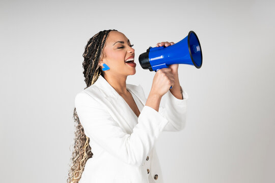 Speaker shouting into a blue megaphone on white background
