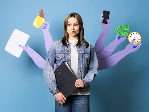 Stressed office worker multitasking with extra paper arms