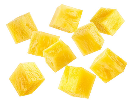 Juicy yellow pineapple chunks falling dynamically isolated for food designers to create fresh product packaging on a transparent background to promote tropical vitality and enjoyment