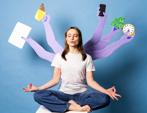 Employee meditating with multiple paper arms managing multitasking