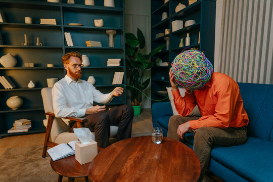 Psychotherapist unwinding wire from patient's thoughts