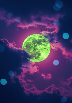 Large glowing green moon surrounded by pink clouds and flying bird silhouettes for mysterious nature covers, sci-fi concept art and nocturnal atmosphere backgrounds