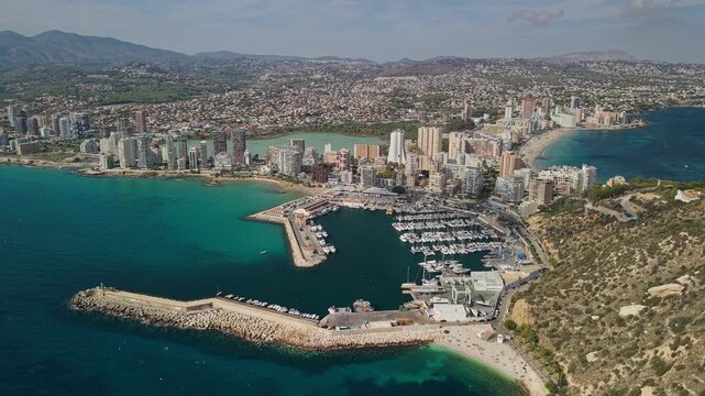 Aerial panorama of Calpe marina harbor beaches and skyline on Costa Blanca Spain