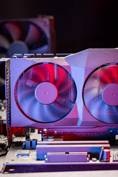 Few motherboards with heatsink. fans and graphics card.