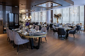 Fototapete Hotel Chic Stylish modern hotel restaurant interior with refined new design elements  © rilueda
