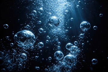 Obraz premium air bubbles enriched with oxygen underwater dark background