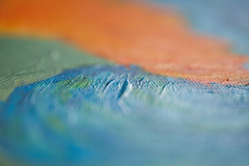 Vibrant macro photography of orange and blue acrylic paints blending together, showcasing rich textures, fluid motion, and striking colour contrast in an abstract composition © nicholasjermy