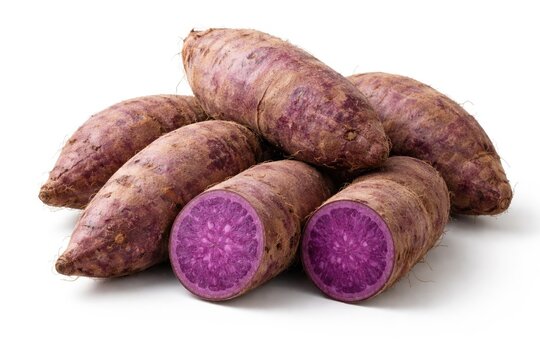 Group of raw purple yams placed neatly on plain white surface