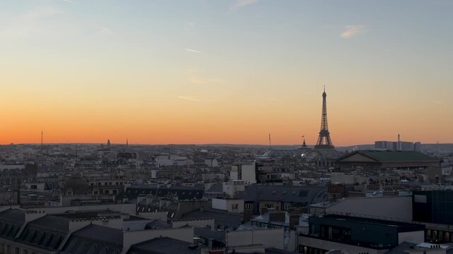 Drone captures illuminated rooftops over Paris metropolis