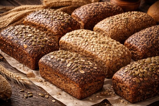 Assorted seeded gluten free bread loaves made with whole grains arranged for display