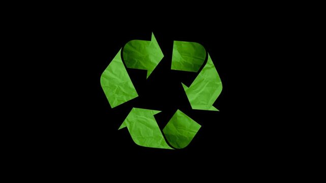 Green recycle symbol isolated on black background. Video graphics animation 