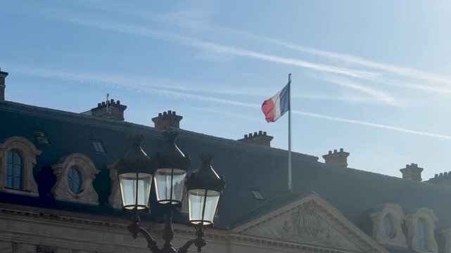 French flag midday over ornate palace lively editorial shot