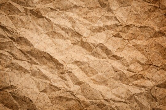 Background texture of recycled paper with crinkles in various earthy tones for designs