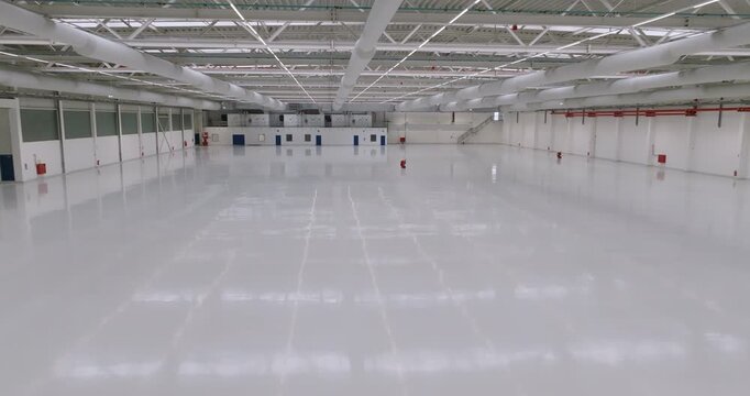 Interior of an empty commercial storage facility with multiple loading dock doors