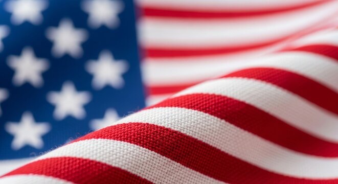 American flag waving with stars and stripes close up view of fabric texture and colors