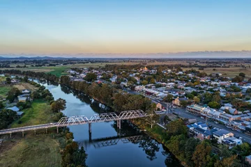 Fotobehang Blauw Aerial view of bridge over river and country town of Morpeth in New South Wales, Australia. Scenic rural landscape showing waterway, bridge crossing and surrounding township.  © SCLifestyle
