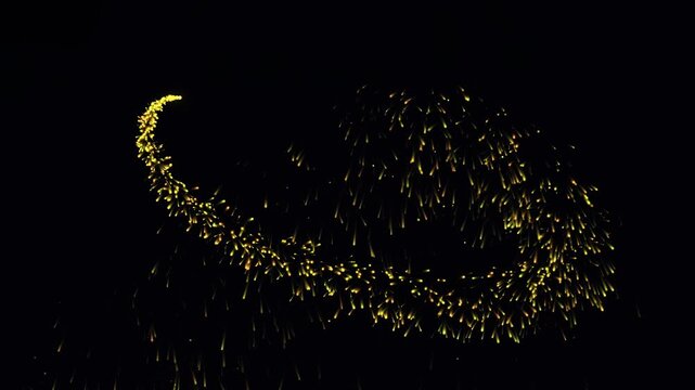 Premium 4K resolution video footage showing a fast fluid abstract magic trail with sparkling golden sparkles and pixie dust effects. Cinematic movement on a deep dark background. Ideal for magic