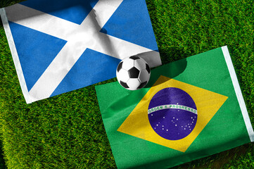 Fototapeta premium Scotland vs Brazil, national flags before world championship Group C group stage match, football on green pitch with goal in the background, Miami Gardens, USA, June 24, 2026