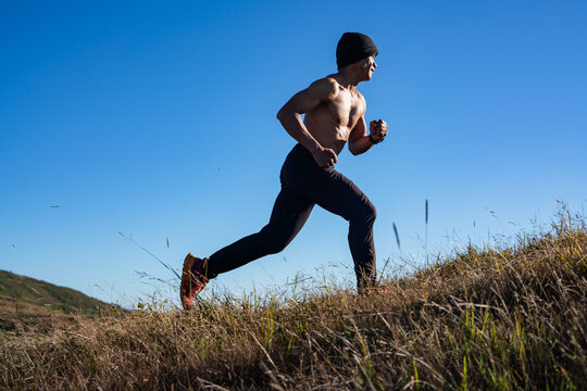 Running progress a shirtless athlete's journey through nature outdoor sports environment inspirational viewpoint