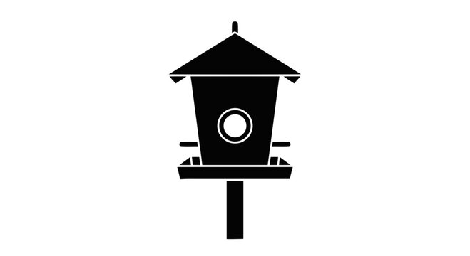 Birdhouse on a wooden post.