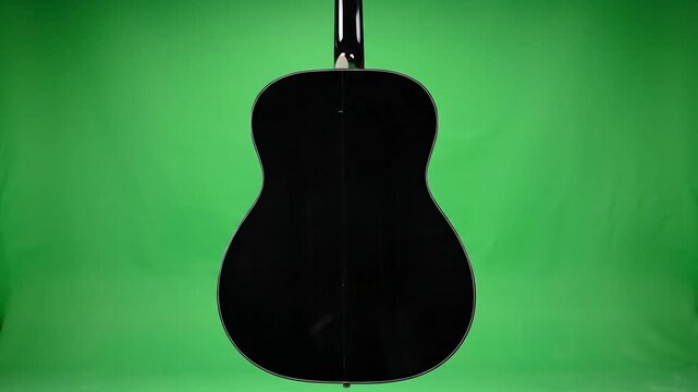 Acoustic Guitar Studio Shot on Green Screen Background.