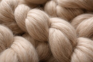 Fototapeta premium Beige smoky merino wool yarn fibers shown in detailed close-up for blanket making