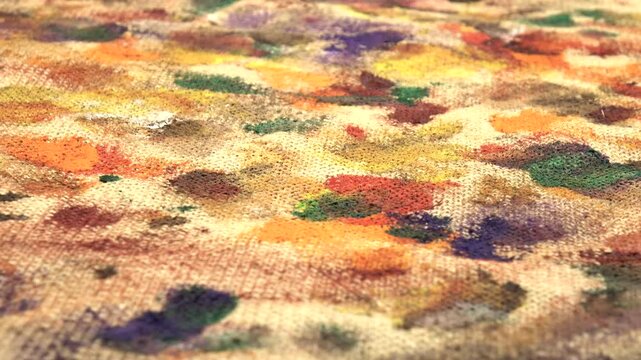 Various multi-colored spots of different shapes from paint brushes with gouache and acrylic paint on the beige burlap fabric, abstract background, side view