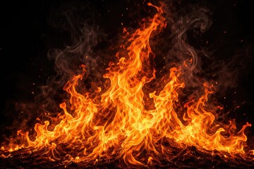 Fototapeta premium Bright orange flames dancing with smoky wisps on black background for graphic design