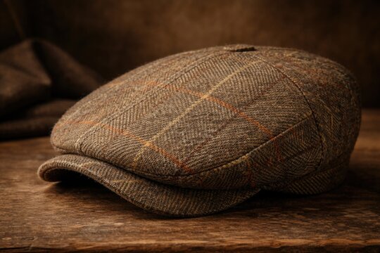 Heritage wool tweed flat cap for men captured with smooth studio background
