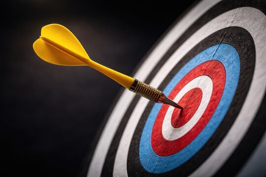 Conceptual image of a yellow dart near but not hitting target on white