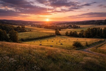 Fototapeta premium Expansive rural terrain with thriving fields and grasslands under dusk sky