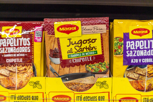 Villa de Alvarez, Colima. Mexico. April 14, 2026: Mexican Chipotle Flavor Seasoning Mix Packets Displayed on Shelf. Maggi brand