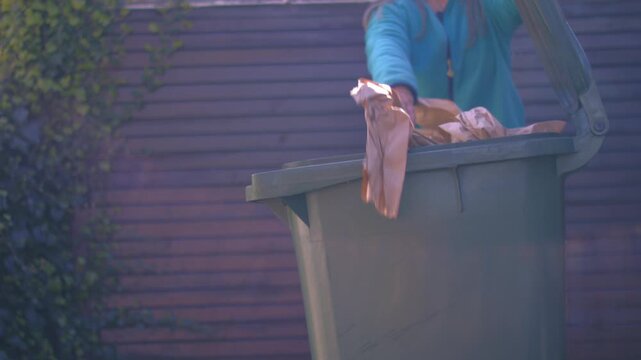 Reycling paper in the bin 