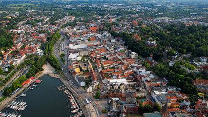 Obraz premium Aerial view around the old town of the city Flensburg in Germany on a sunny spring noon