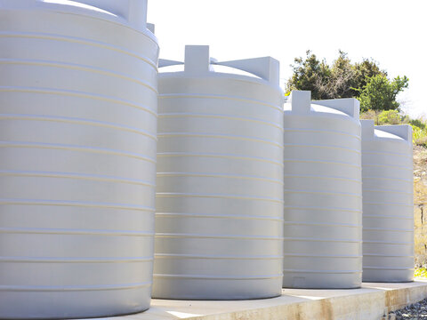 Large White Water Storage Tanks Outdoors And Aligned