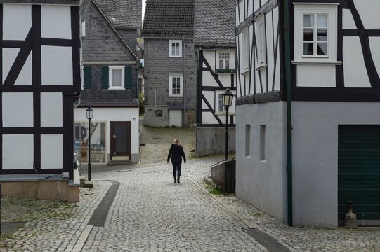 The historic centre with half timbered houses of Friedensdorf Germany, a village in the municipality of Saerbeck, district Steinfurt, the state of North Rhine-Westphalia. Street and facades.